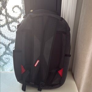 Sprayground Black and Red Backpack Modern Design